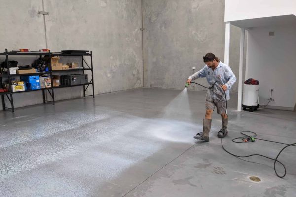Man Burnishing the Concrete Floor