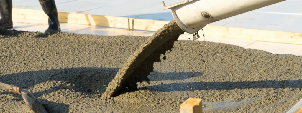 pouring concrete from a concrete mixer