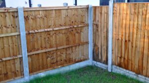 New Wooden panel garden fence and concrete posts